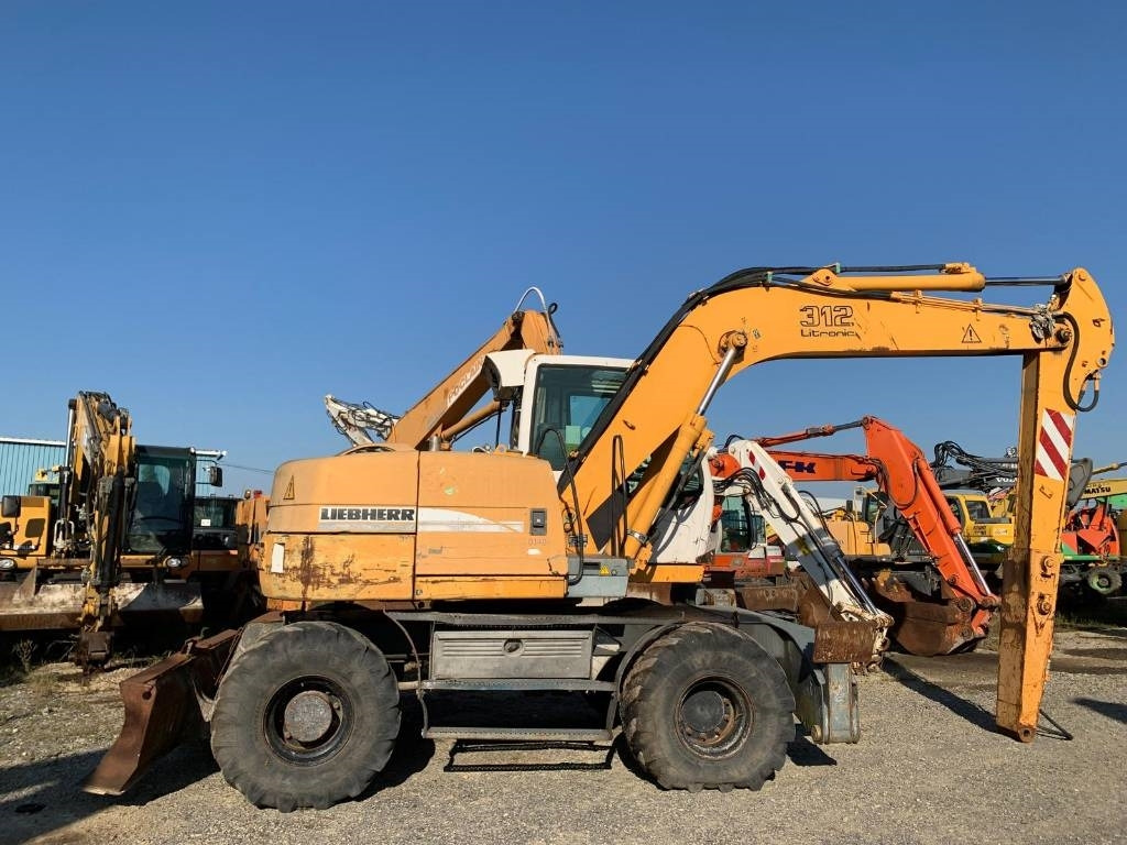 Máy xúc bánh lốp Liebherr A 312: hình 6 Máy xúc bánh lốp Liebherr A 312: hình 6