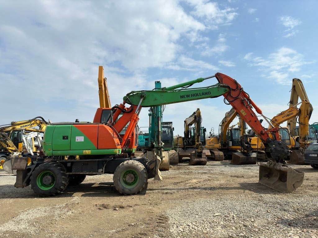 New Holland MH Plus - Máy xúc bánh lốp: hình 2 New Holland MH Plus - Máy xúc bánh lốp: hình 2