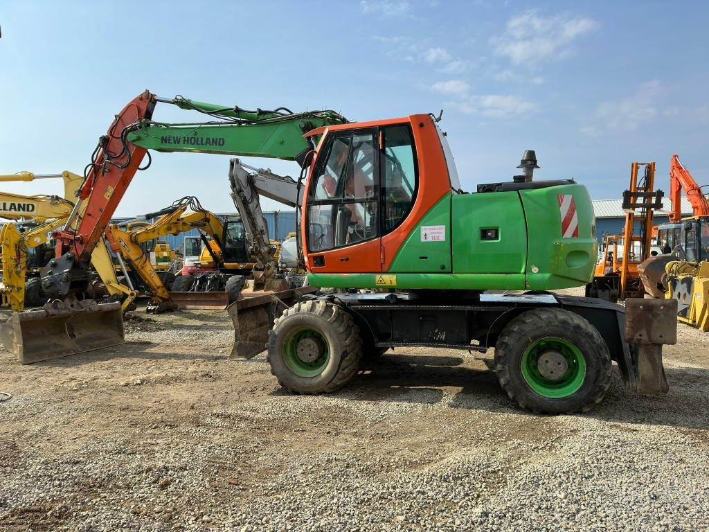 Máy xúc bánh lốp New Holland MH Plus: hình 6 Máy xúc bánh lốp New Holland MH Plus: hình 6