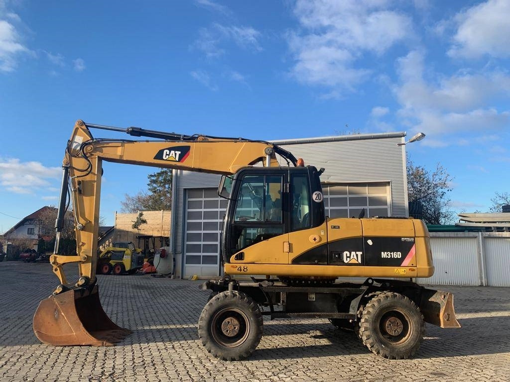 CAT M 316 D - Máy xúc bánh lốp: hình 2 CAT M 316 D - Máy xúc bánh lốp: hình 2