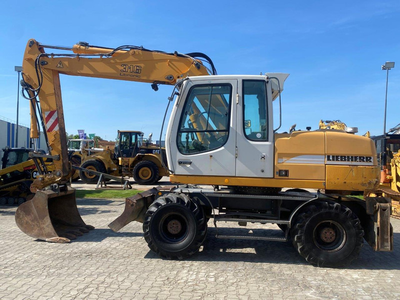 Liebherr A316 Litronic A 316 litronic - Máy xúc bánh lốp: hình 2 Liebherr A316 Litronic A 316 litronic - Máy xúc bánh lốp: hình 2