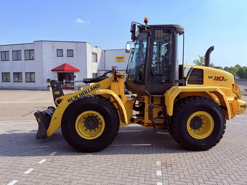 New Holland W110C Wiellader - Máy xúc lật bánh lốp: hình 1 New Holland W110C Wiellader - Máy xúc lật bánh lốp: hình 1