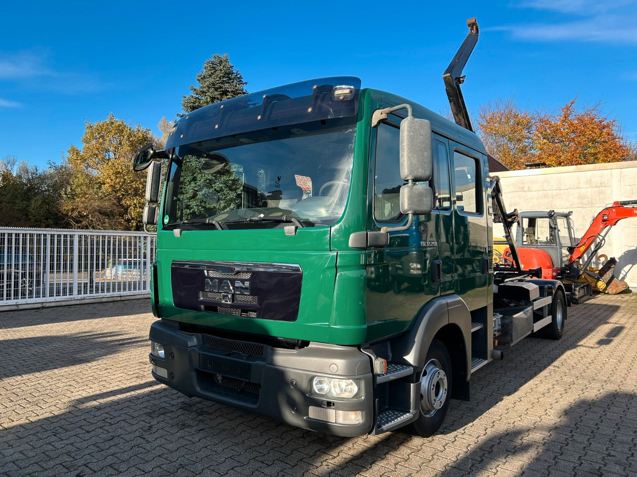 MAN 12.250 Doppelkabine Abroller - Xe tải nâng móc: hình 1 MAN 12.250 Doppelkabine Abroller - Xe tải nâng móc: hình 1