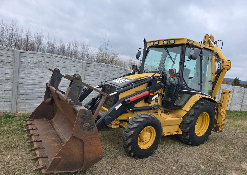 Caterpillar - Máy xúc trước múc sau: hình 1 Caterpillar - Máy xúc trước múc sau: hình 1