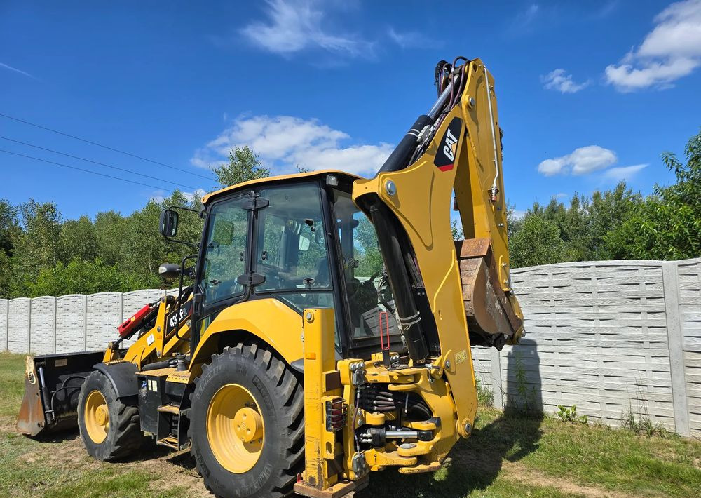 Máy xúc trước múc sau Caterpillar: hình 7
