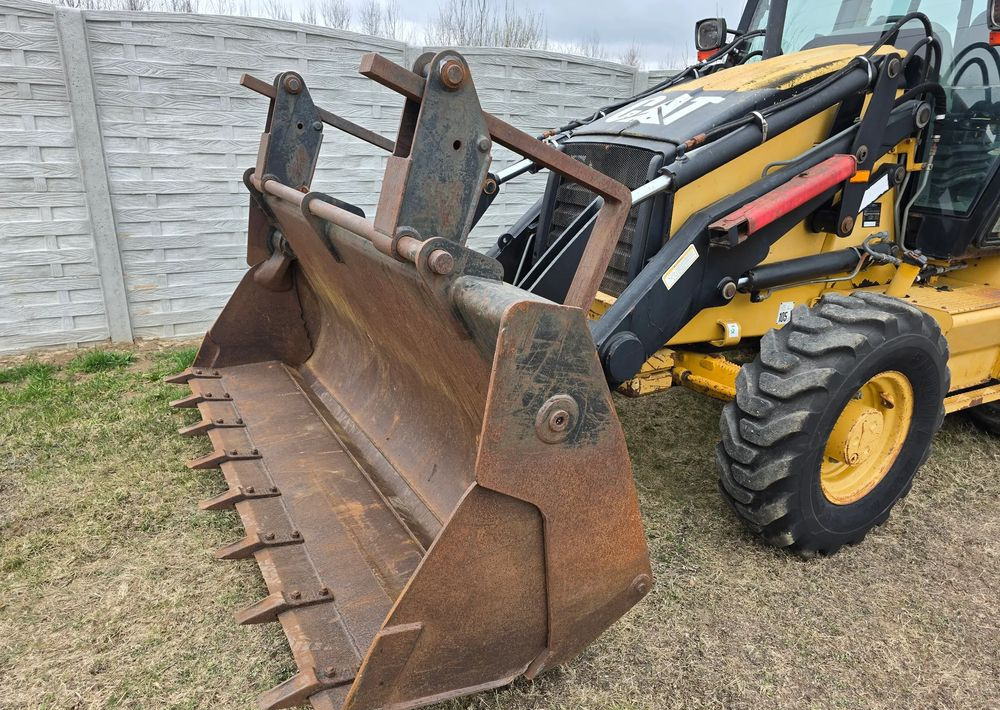 Caterpillar - Máy xúc trước múc sau: hình 4 Caterpillar - Máy xúc trước múc sau: hình 4