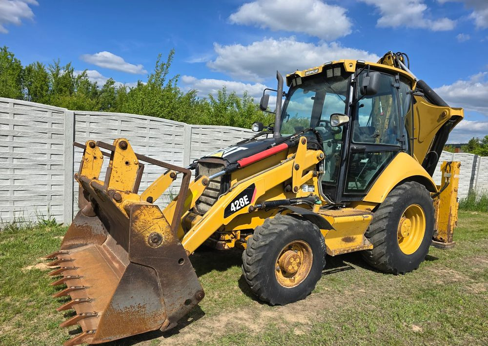 Caterpillar - Máy xúc trước múc sau: hình 2 Caterpillar - Máy xúc trước múc sau: hình 2