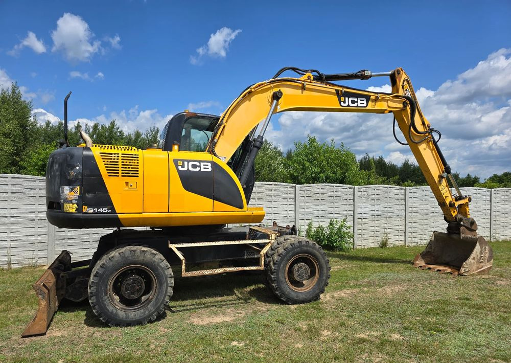 JCB - Máy xúc bánh lốp: hình 2 JCB - Máy xúc bánh lốp: hình 2