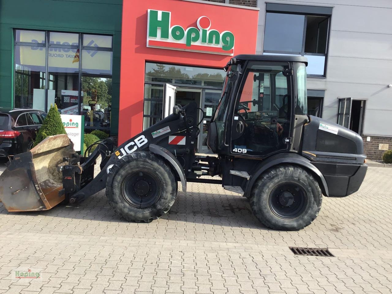 JCB 409 - Máy xúc lật bánh lốp: hình 1 JCB 409 - Máy xúc lật bánh lốp: hình 1