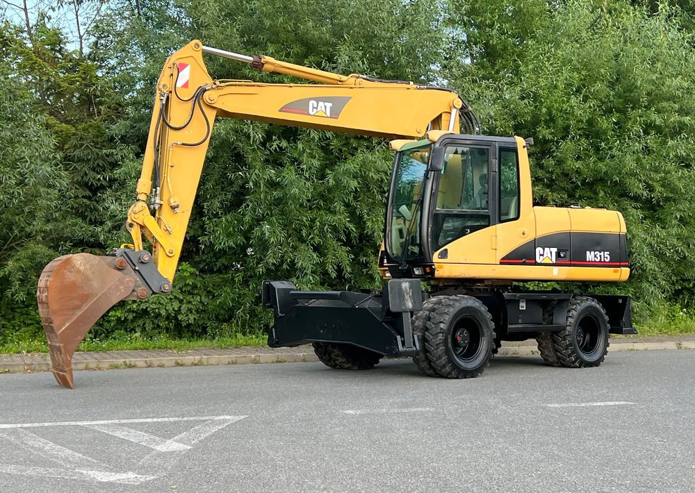 Máy xúc bánh lốp Caterpillar CAT M315C  CATERPILLAR SPROWADZONY  Bardzo Dobry Stan: hình 1