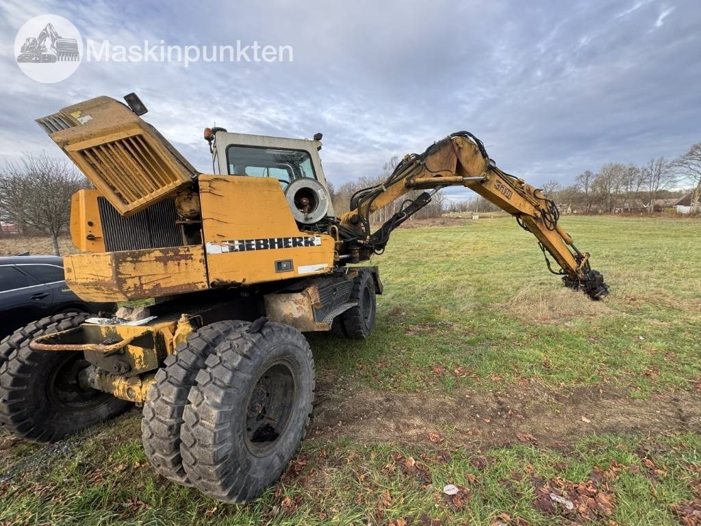 Liebherr A 310 B - Máy xúc bánh lốp: hình 3 Liebherr A 310 B - Máy xúc bánh lốp: hình 3