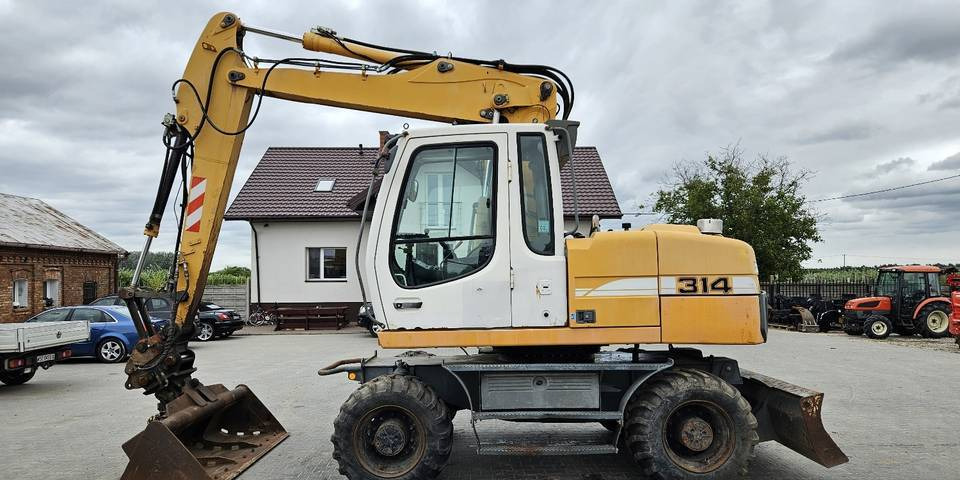 Koparka kołowa Liebherr A314 Litronic 9350 h 4 łyżki kołówka - Máy xúc bánh lốp: hình 1 Koparka kołowa Liebherr A314 Litronic 9350 h 4 łyżki kołówka - Máy xúc bánh lốp: hình 1
