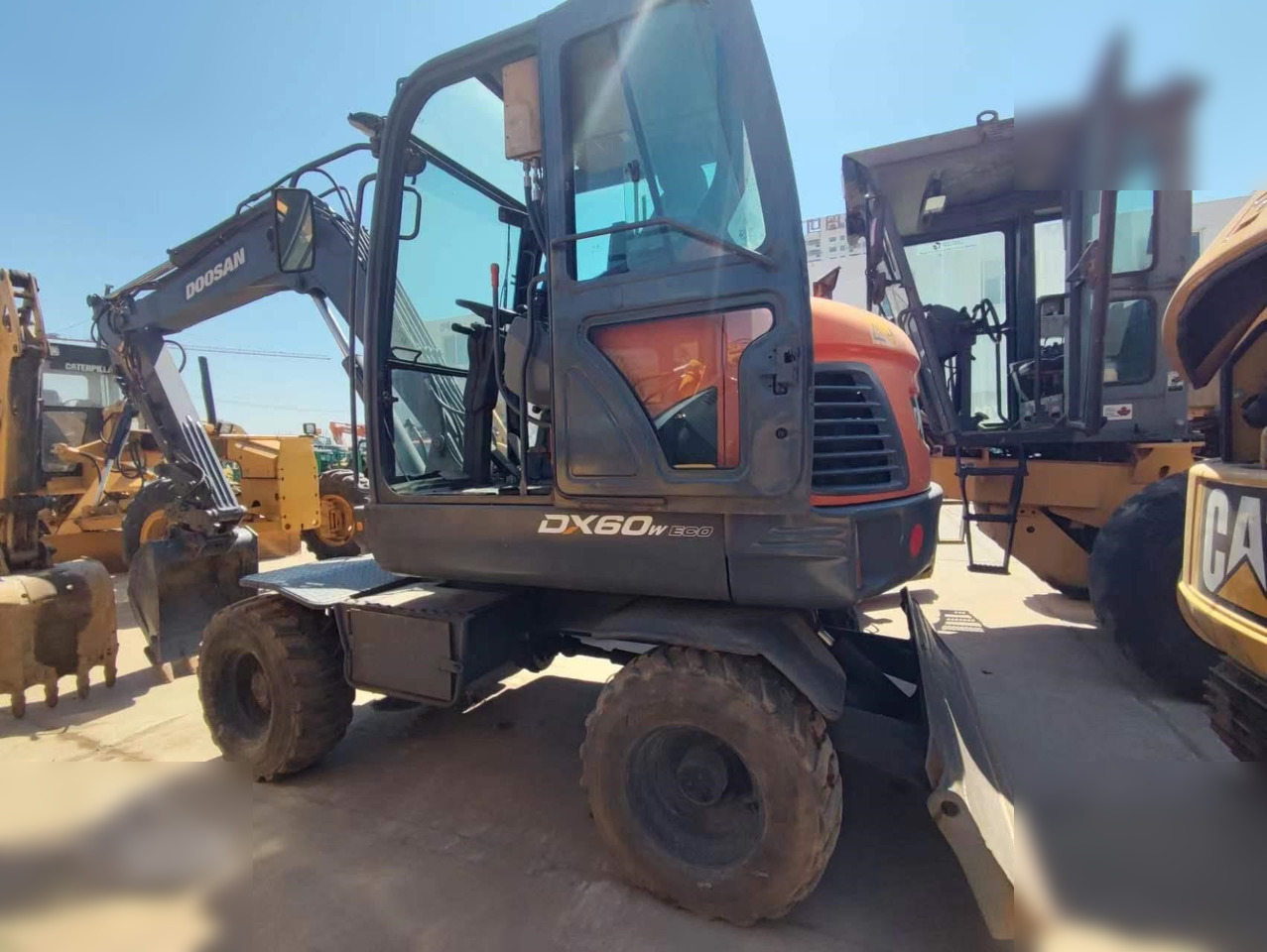 DOOSAN DX60W ECO - Máy xúc bánh lốp: hình 1 DOOSAN DX60W ECO - Máy xúc bánh lốp: hình 1