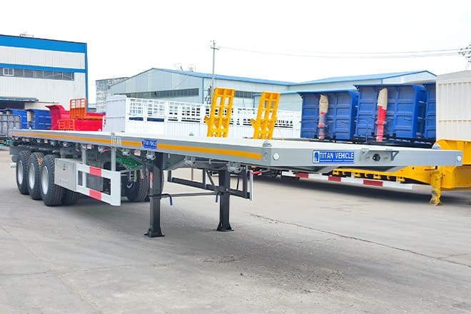 TITAN Tri Axle 40Ft Flatbed Trailer Price for Sale in Sierra Leone - Sơ mi rơ moóc thùng lửng/ Phẳng: hình 1 TITAN Tri Axle 40Ft Flatbed Trailer Price for Sale in Sierra Leone - Sơ mi rơ moóc thùng lửng/ Phẳng: hình 1
