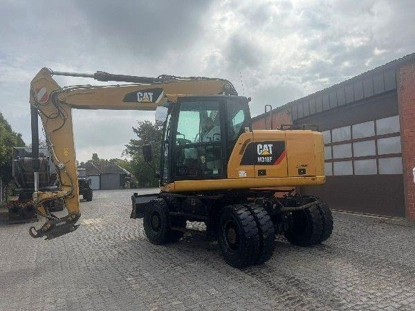 CAT M318F - Máy xúc bánh lốp: hình 2 CAT M318F - Máy xúc bánh lốp: hình 2