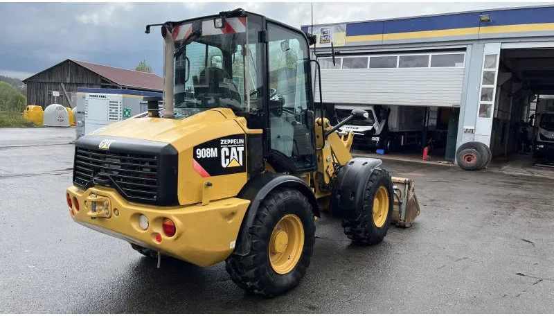 Caterpillar 908 M Klappschaufel+Pal.gabel Schnellwechsl. 908 M 4x4 Klappschaufel+Pal.gabel Schnellwechsl. - Máy xúc lật bánh lốp: hình 3 Caterpillar 908 M Klappschaufel+Pal.gabel Schnellwechsl. 908 M 4x4 Klappschaufel+Pal.gabel Schnellwechsl. - Máy xúc lật bánh lốp: hình 3