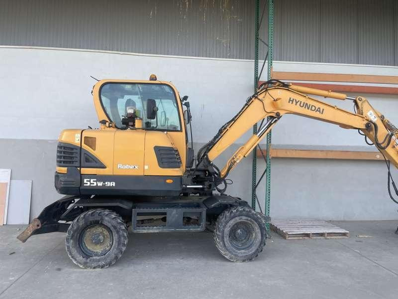 Hyundai R55W-9A - Máy xúc bánh lốp: hình 1 Hyundai R55W-9A - Máy xúc bánh lốp: hình 1