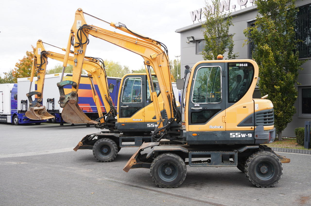 Hyundai Robex 55W-9 Wheeled Excavator 5.5t / 2pcs - Máy xúc mini: hình 1 Hyundai Robex 55W-9 Wheeled Excavator 5.5t / 2pcs - Máy xúc mini: hình 1