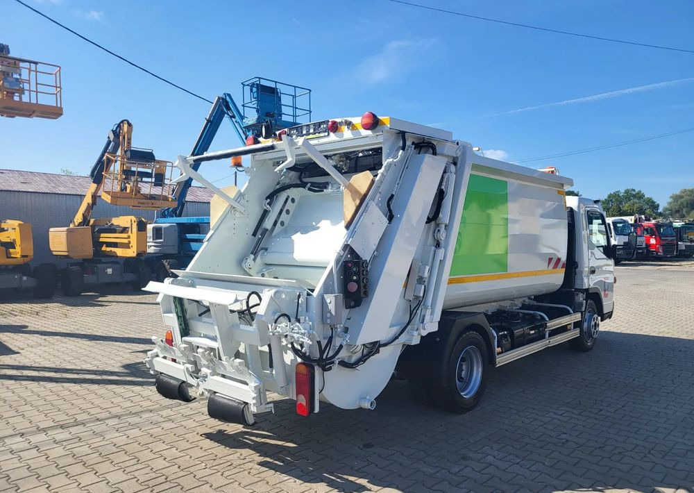 Mitsubishi Fuso Canter - Xe tải chở rác: hình 5 Mitsubishi Fuso Canter - Xe tải chở rác: hình 5