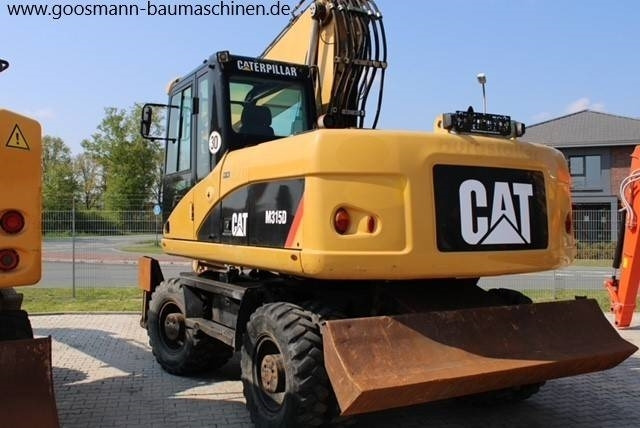 CAT M 315 D - Máy xúc bánh lốp: hình 2 CAT M 315 D - Máy xúc bánh lốp: hình 2