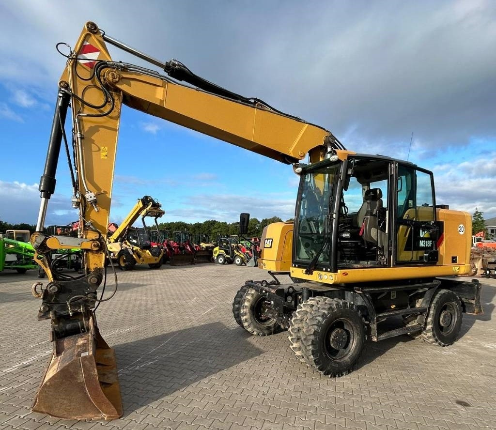 CAT M 318 F - Máy xúc bánh lốp: hình 1 CAT M 318 F - Máy xúc bánh lốp: hình 1