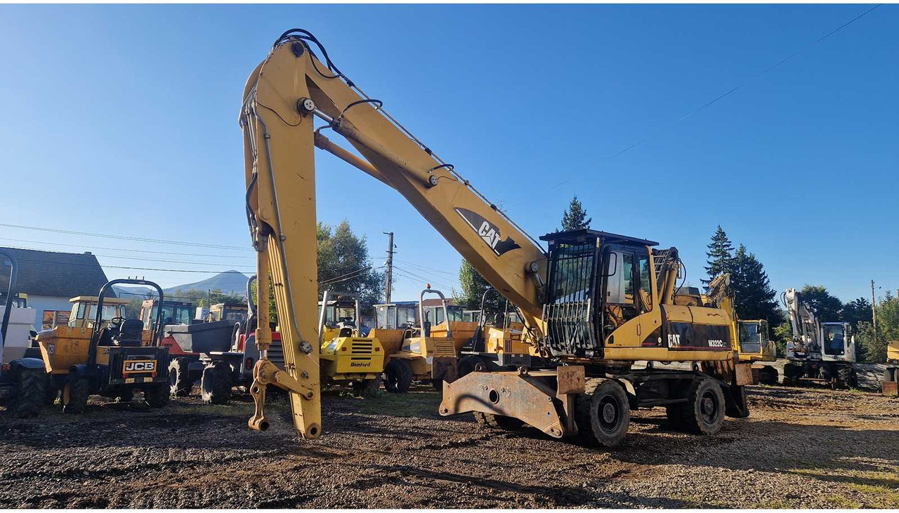 Caterpillar M322C - Máy xúc bánh lốp: hình 1 Caterpillar M322C - Máy xúc bánh lốp: hình 1