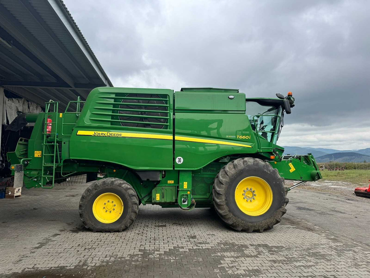 JOHN DEERE T660I - Máy gặt đập: hình 1 JOHN DEERE T660I - Máy gặt đập: hình 1