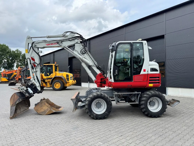 Takeuchi TB295W BJ 2021 3500 uur Compacttilt Draaikantelstuk met Gripper ! - Máy xúc bánh lốp: hình 1 Takeuchi TB295W BJ 2021 3500 uur Compacttilt Draaikantelstuk met Gripper ! - Máy xúc bánh lốp: hình 1