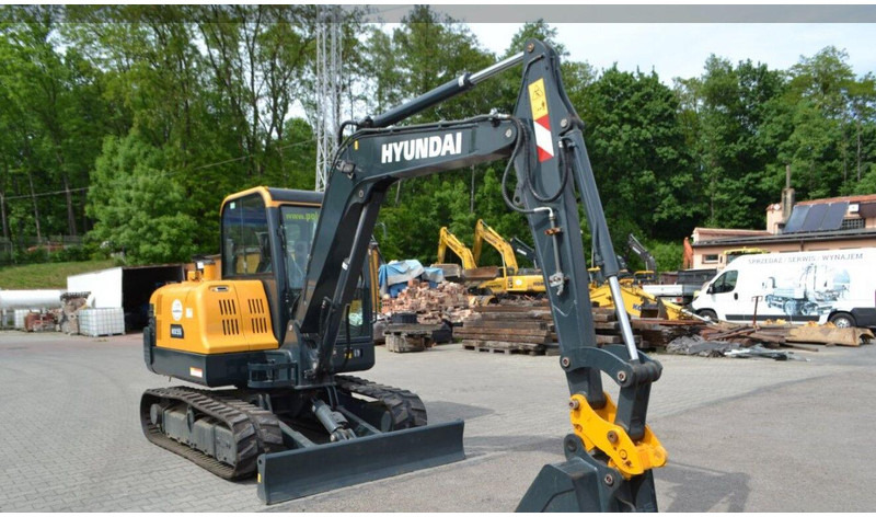 Hyundai HX55 Mini lánctalpas forgókotró - Máy xúc mini: hình 1 Hyundai HX55 Mini lánctalpas forgókotró - Máy xúc mini: hình 1