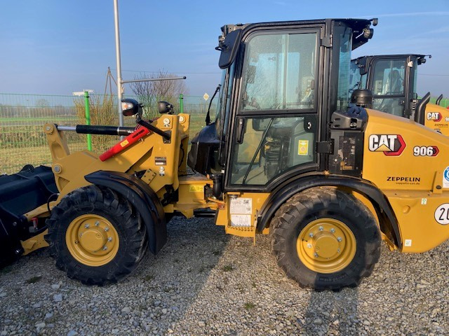 Caterpillar 906-14A - Máy xúc lật bánh lốp: hình 1 Caterpillar 906-14A - Máy xúc lật bánh lốp: hình 1