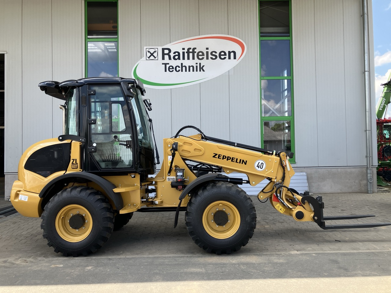 Caterpillar Zeppelin ZL60T - Máy xúc lật bánh lốp kính thiên văn: hình 1 Caterpillar Zeppelin ZL60T - Máy xúc lật bánh lốp kính thiên văn: hình 1