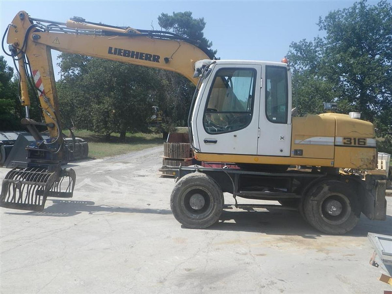 Liebherr A316Li - Máy xúc: hình 3 Liebherr A316Li - Máy xúc: hình 3