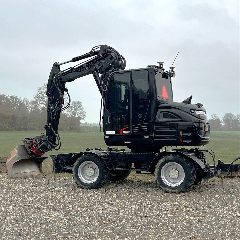 Takeuchi TB295 W - Máy xúc bánh lốp: hình 2 Takeuchi TB295 W - Máy xúc bánh lốp: hình 2