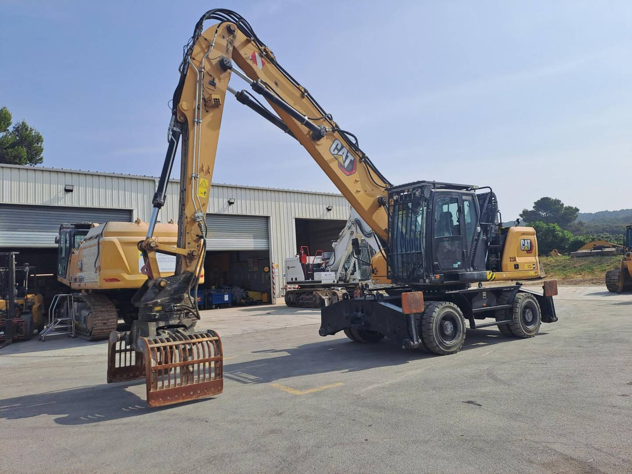 CAT MH3024 - Máy xúc bánh lốp: hình 1 CAT MH3024 - Máy xúc bánh lốp: hình 1
